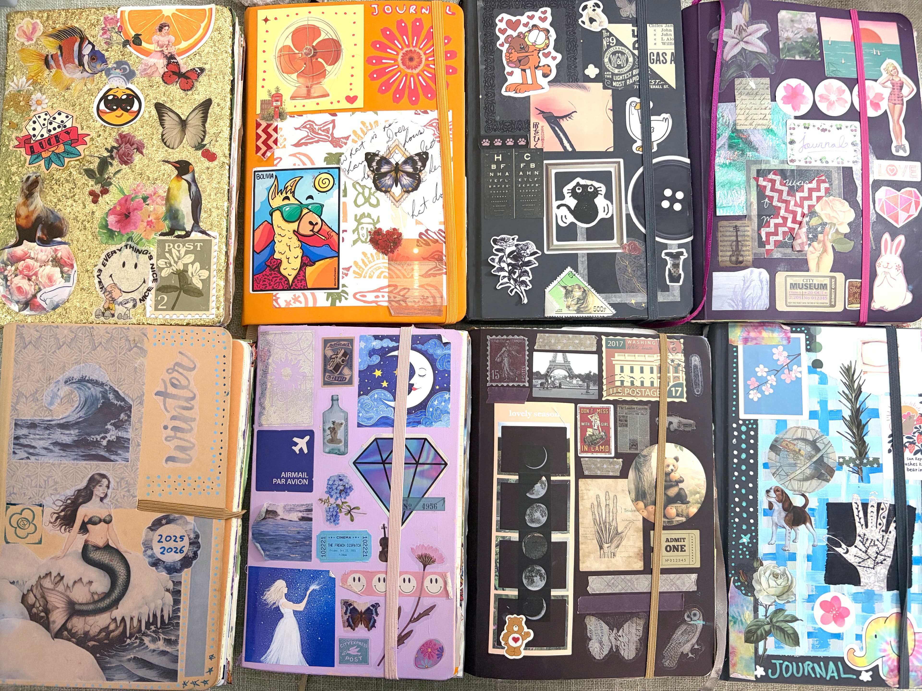 Eight creative journals with distinctly different aesthetics, featuring colorful collage, vintage paper, stickers, florals, illustrations, and layered ephemera.